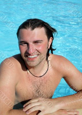 Man posing in pool