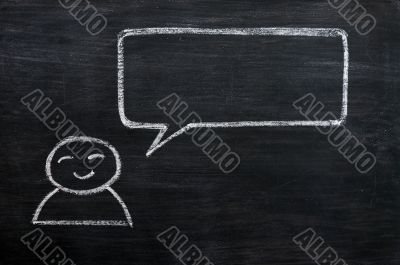 Blank speech bubble with a man figure drawn on a blackboard background