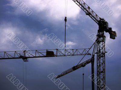Cranes and rain clouds