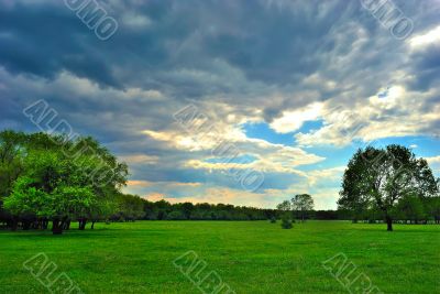 Cloud over the green meadow