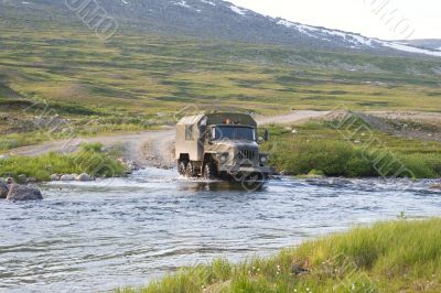 Truck crossing a river