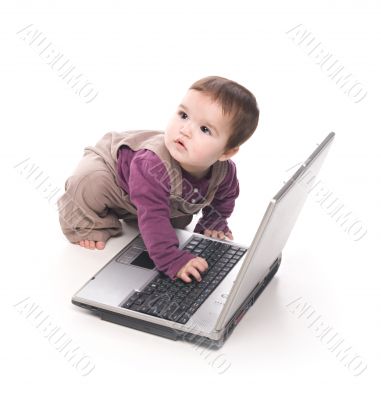 Baby girl with a laptop