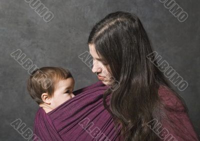 Mother with her daughter in sling