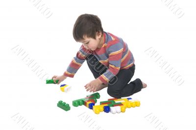 Boy with multicolored bricks