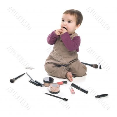 Baby girl with cosmetics