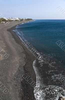 Kamari black pebble beach