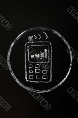 Chalk drawing of mobile phone symbol on blackboard background