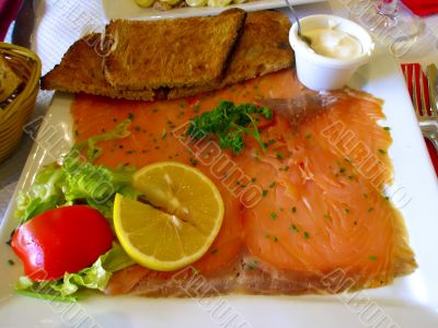 Dish of smoked salmon in the French restaurant