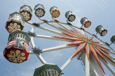 Ferris wheel against blue sky