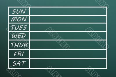 Blank weekday calendar form written with chalk on green chalkboard