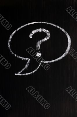 Chalk drawing of speech bubble with question mark