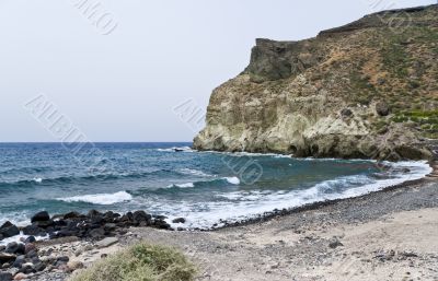 Santorini beach with black pumice