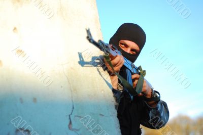 terrorist with mask and gun