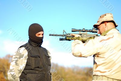 soldier aiming terrorist