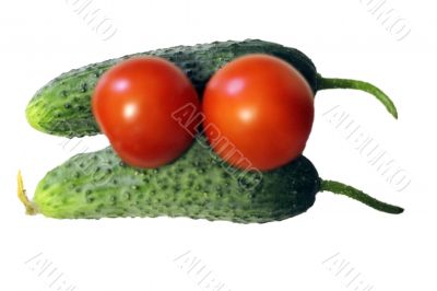 Red tomato and two cocumbers isolated on the white background