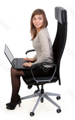 girl in a chair with a laptop