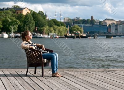 girl sitting in the pier