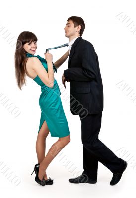 girl holds a businessman in tie