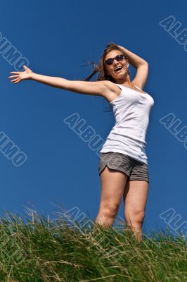 girl in sunglasses and a white dress