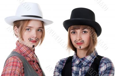 Two girls with painted mustaches