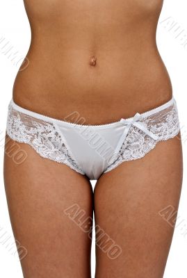 Beautiful tanned body of a woman in shorts