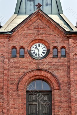 clock on the old brick Church