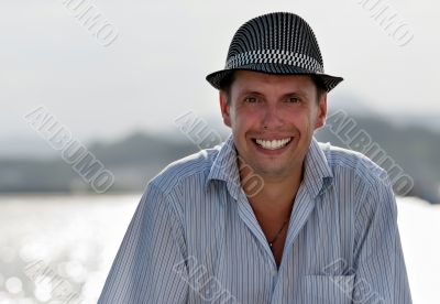 portrait of a smiling man in a hat