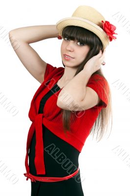 Portrait of brunette girl in a hat with a flower and a red sweat