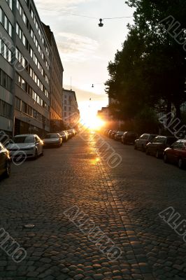 European narrow street with parked cars