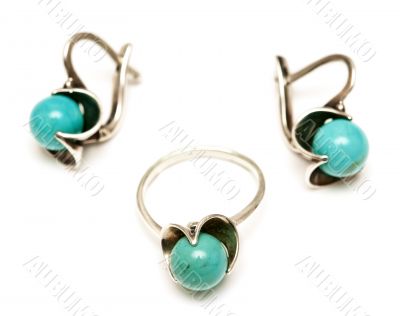 set of silver earrings and a ring