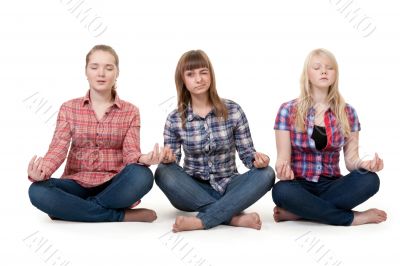 Three girls sitting in lotus posture