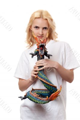 beautiful girl with a wooden dragon