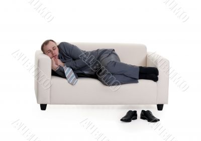 businessman sleeping on a sofa