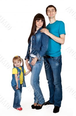 father, mother and young daughter in jeans