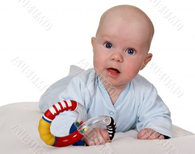infant with colored plastic toy