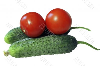 Red tomato and two cocumbers isolated on the white background
