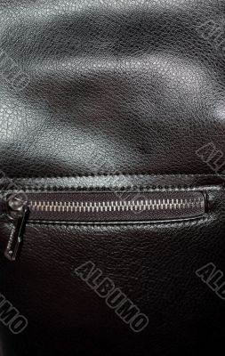Zipper on dark brown leather hand bag