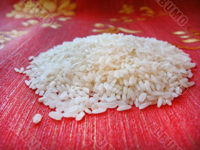 scattered rice on a red background