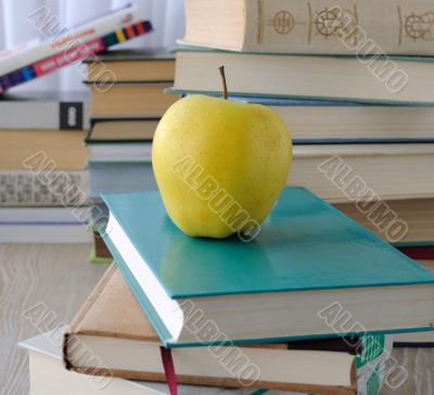 Apple on stack of books