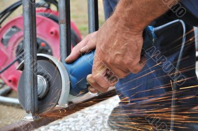 Worker hands with grinder
