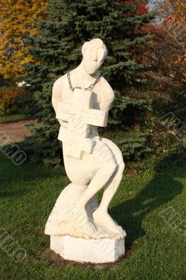 Sculpture of a man with a cross