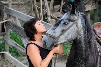 Portrait happy smiling woman with horse