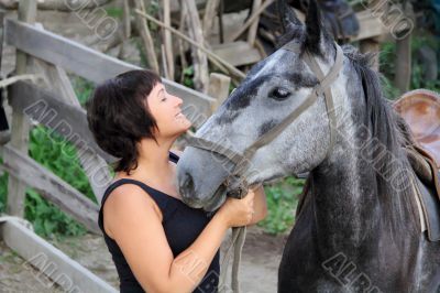 Portrait happy smiling woman with horse