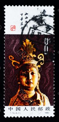 A stamp printed in China shows the ancient buddha statue