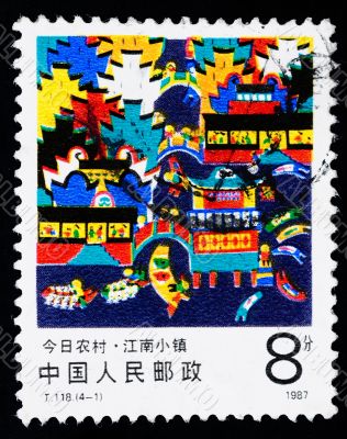 A stamp printed in China shows the modern village