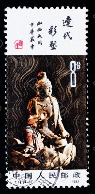 A stamp printed in China shows the ancient buddha statue