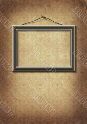 frame hangs on an old wall