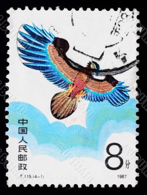 A stamp printed in China shows a kite of eagle figure  in the sky