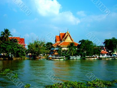Lake With Buildings In Backgrond