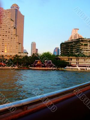 Small Huts Dominated By Taller Buildings